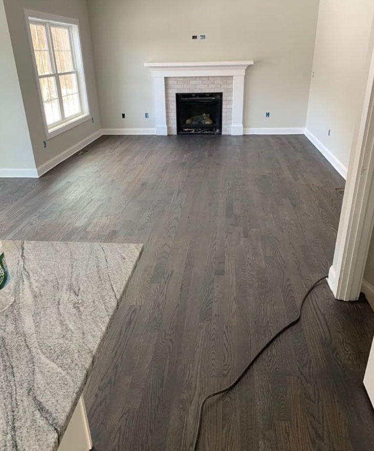 Dark gray stain in a living room with fireplace
