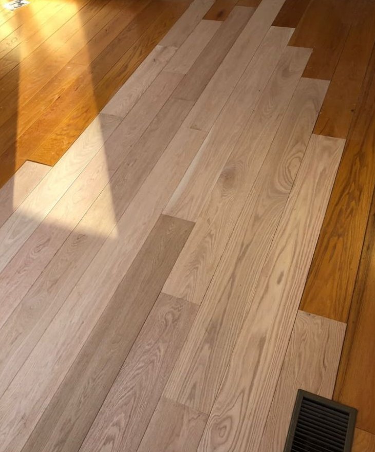 New oak planks woven into an existing floor